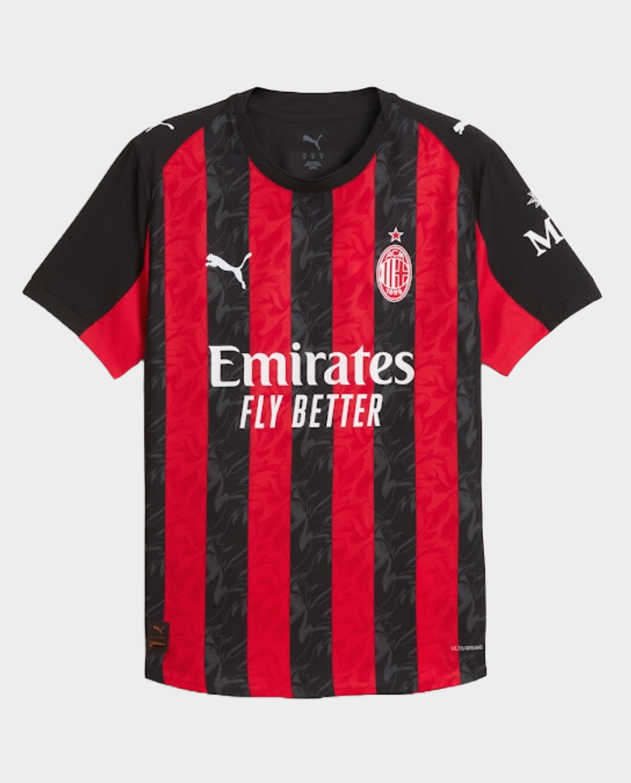 AC Milan home jersey 2025-26 featuring bold red and black stripes with Emirates branding