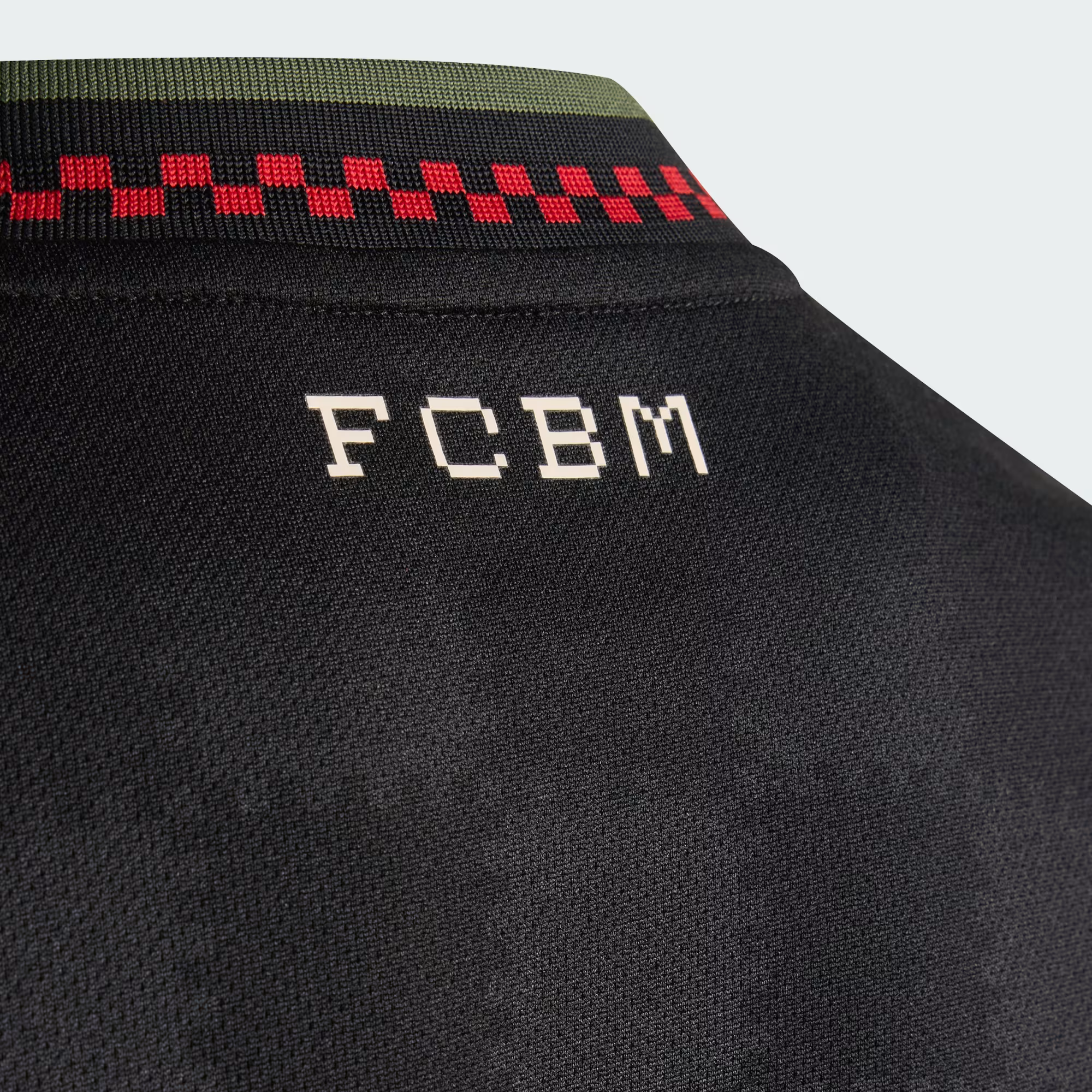Hoop Store Bayern Munich third jersey 2025-26 black back detail with FCBM lettering and green red collar