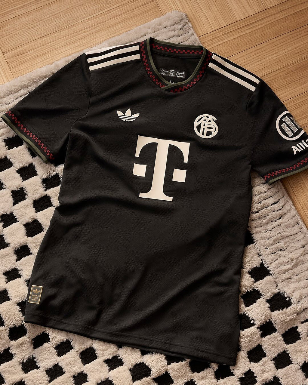 Hoop Store black Adidas style Bayern Munich third jersey 2025-26 with white sponsor logo and red trim