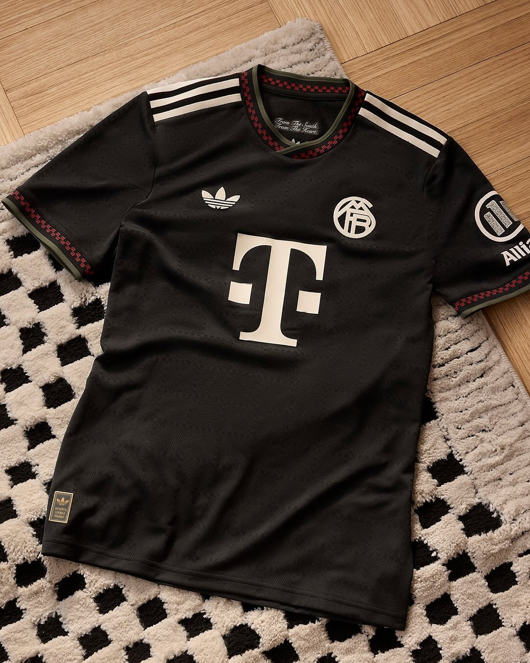 Hoop Store black Adidas style Bayern Munich third jersey 2025-26 with white sponsor logo and red trim