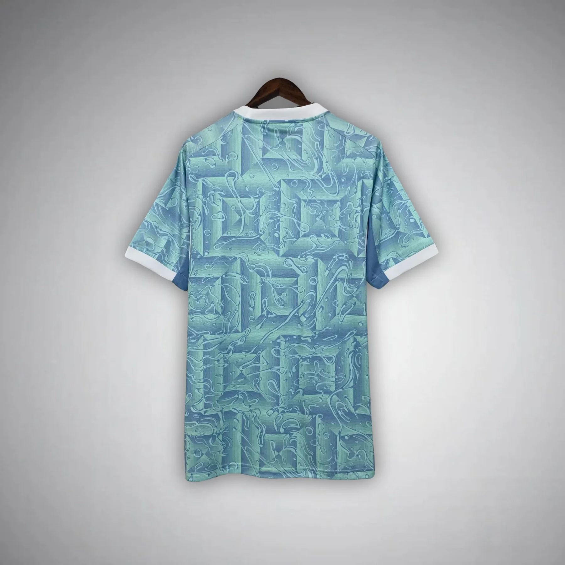 Back view of Juventus away jersey 25-26 with light blue geometric pattern and white collar