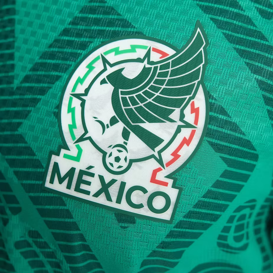 Close-up of the Mexico FIFA 2026 home jersey logo featuring an eagle and green design