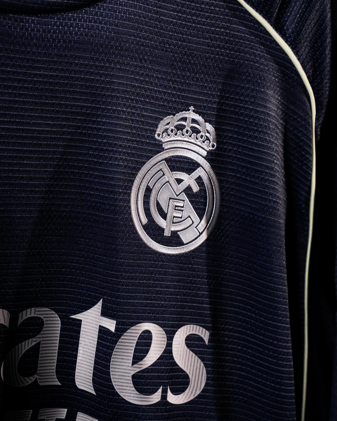 Close-up of Real Madrid away jersey 2025 26 showing club crest and fabric texture