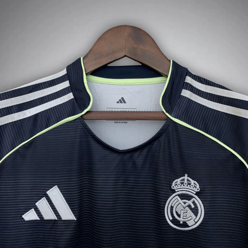 Real Madrid away jersey 2025 26 in black with white Adidas logo and club crest on front