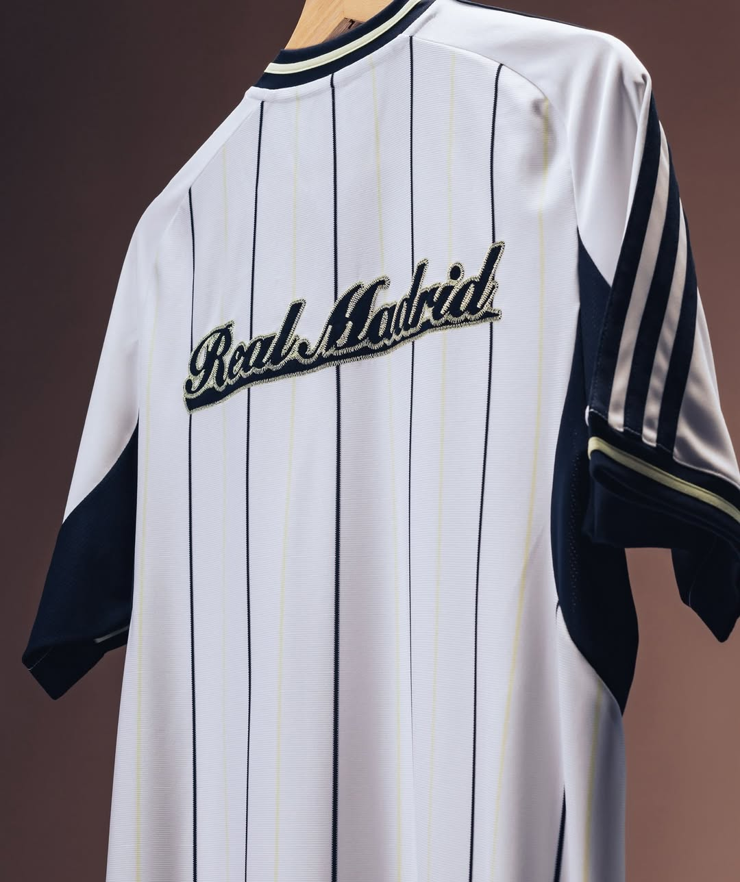 Hoop Store Real Madrid special edition jersey 2025-26 white pinstripe back with navy sleeve stripes and script logo