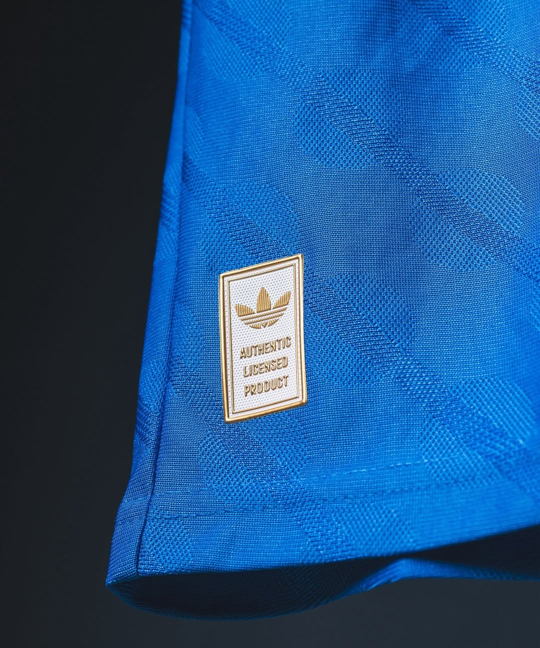 Hoop Store close up of blue Real Madrid Third Jersey 2025-26 hem showing Adidas authentic licensed product patch