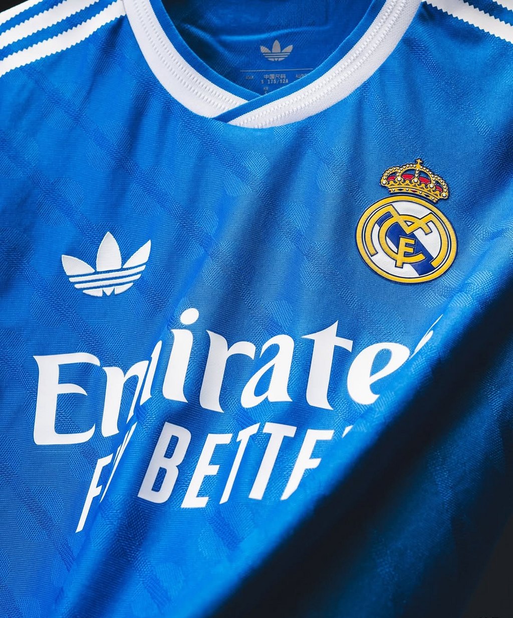 Hoop Store Real Madrid Third Jersey 2025-26 blue Adidas trefoil with club crest and Emirates sponsor