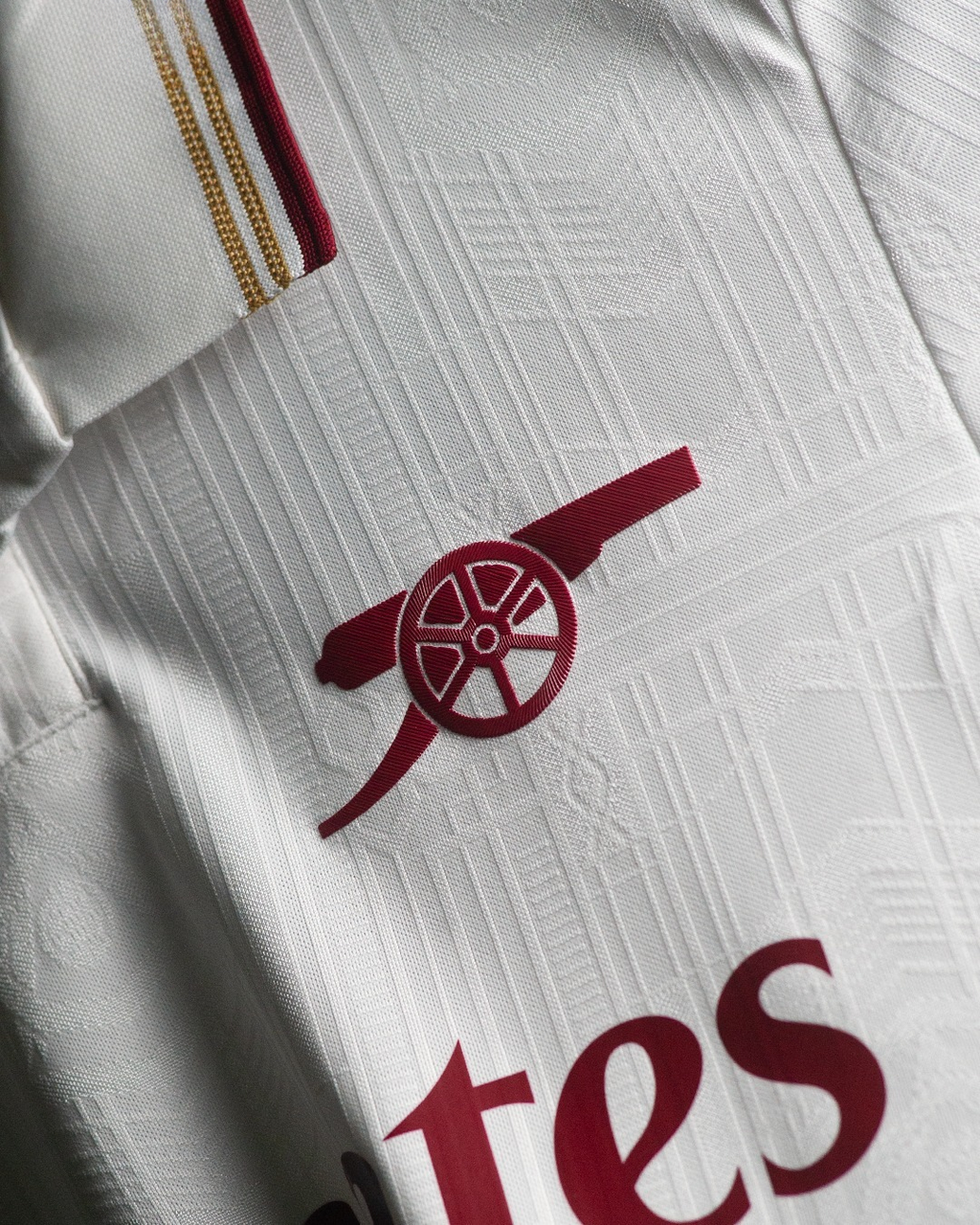 Close-up of Arsenal third jersey 2025-26 player version featuring embroidered club badge