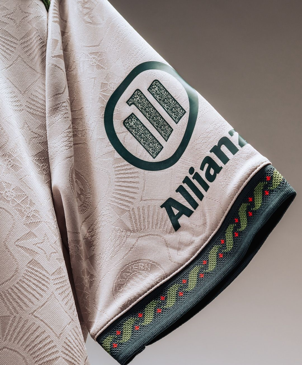 Close-up of Bayern Munich Oktoberfest jersey 2025-26 featuring detailed sleeve design and logo