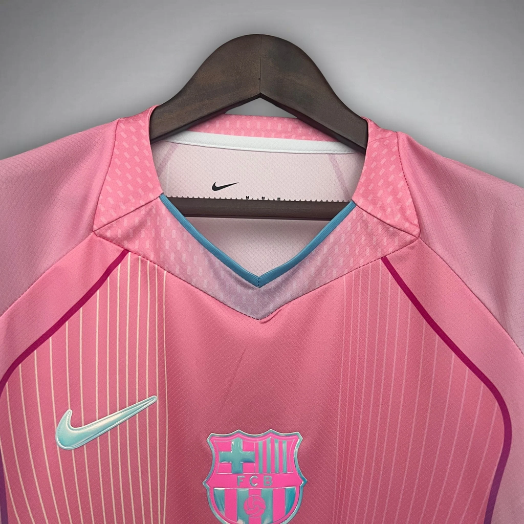 FC Barcelona Pink Jersey 2025 with Nike logo and club crest on a hanger by Hoop Store