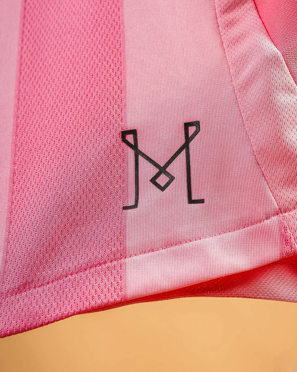 Close-up of the Inter Miami 2025-26 home jersey showing the club logo in stylish detail