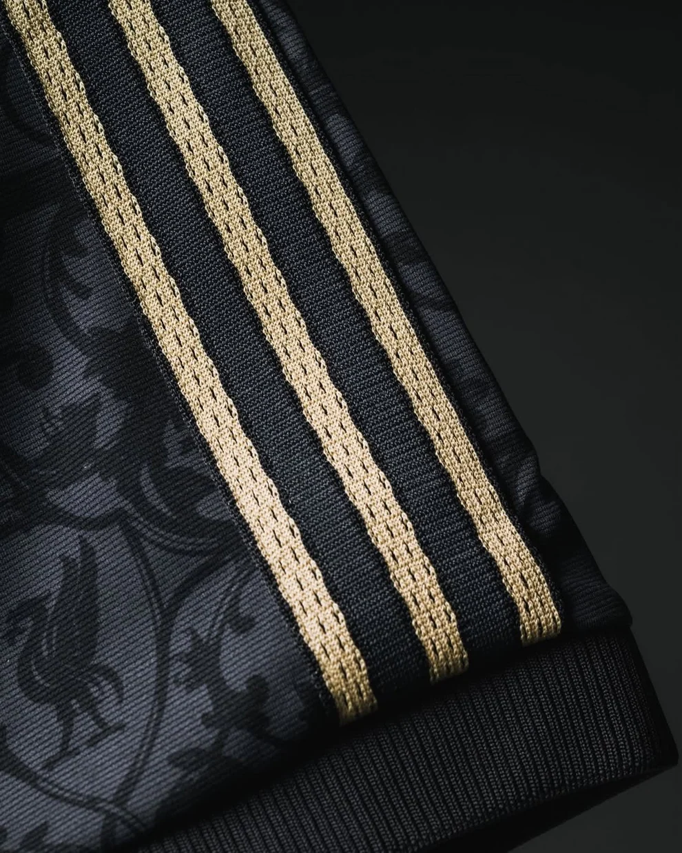 Close-up of the Liverpool LFSTLR Special Edition Jersey featuring gold striped detailing