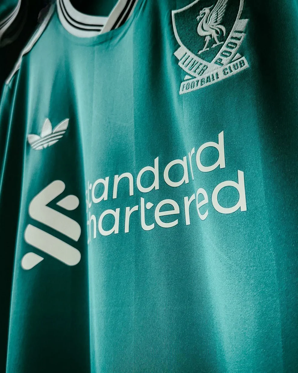 Liverpool third jersey 2025-26 player version in teal with embroidered logos and sponsor details
