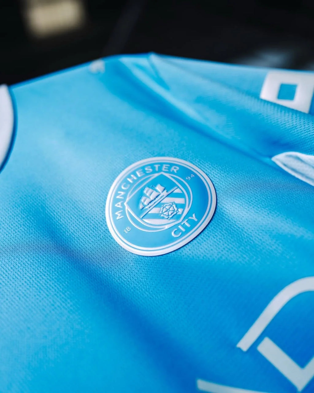 Close-up of Manchester City Home Jersey 2026-27 Fan Version featuring team crest