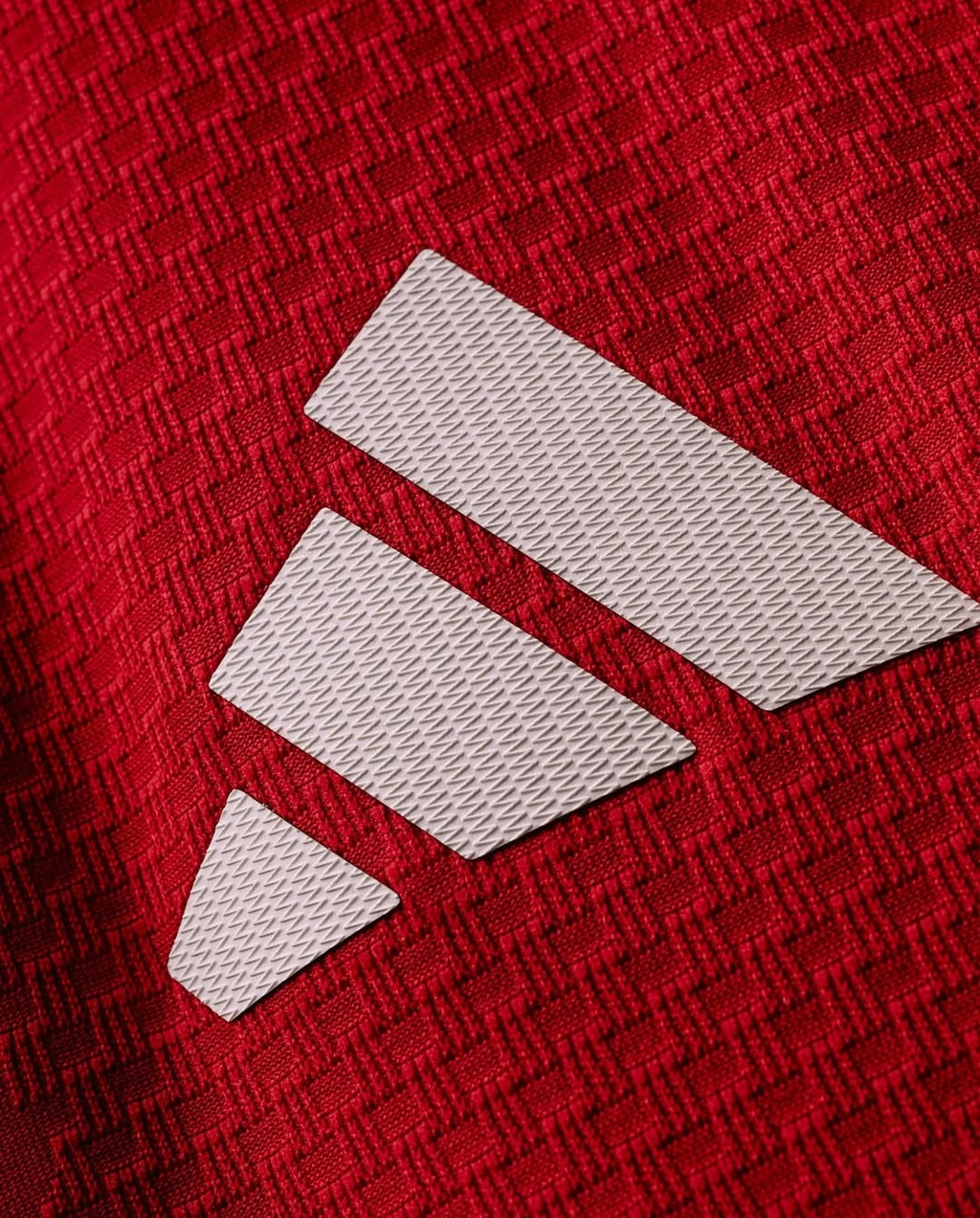 Detailed view of the textured fabric on the Manchester United Home Jersey 2026-27 with logo design