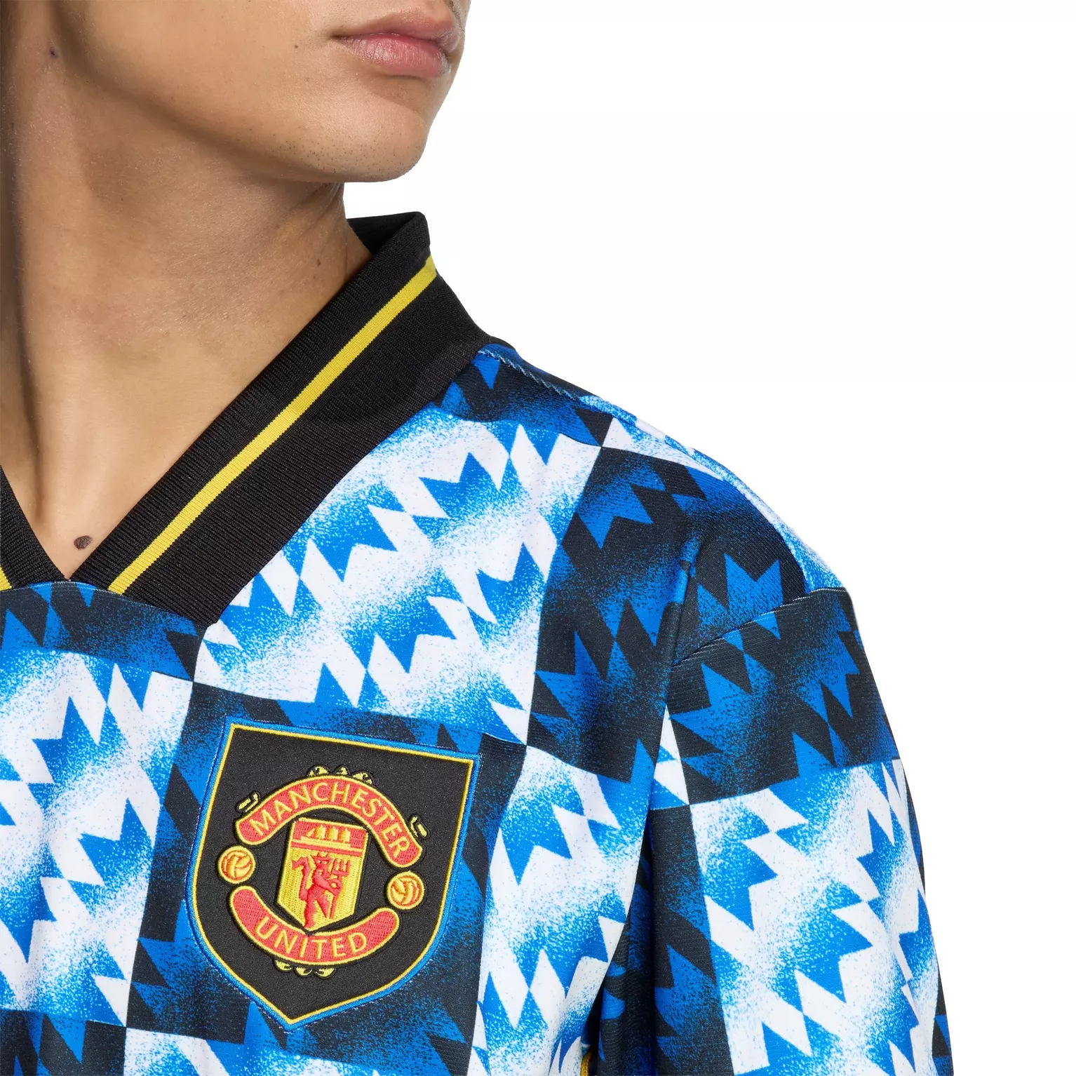Manchester United LFSTLR special edition jersey featuring a vibrant blue and black geometric pattern