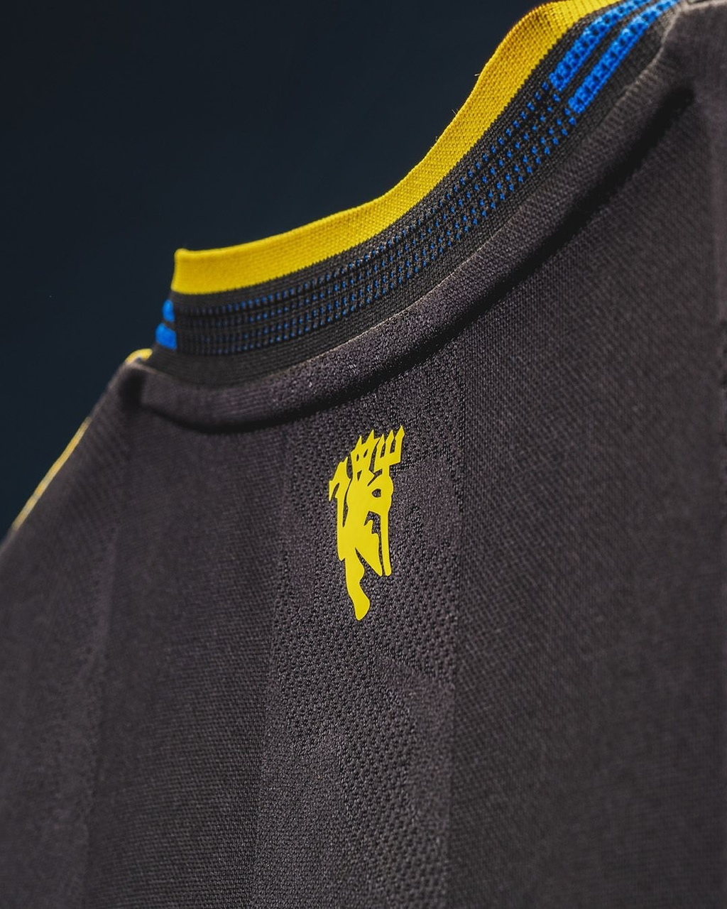 Close-up of the Manchester United third jersey 2025-26 featuring distinctive detailing and vibrant colors
