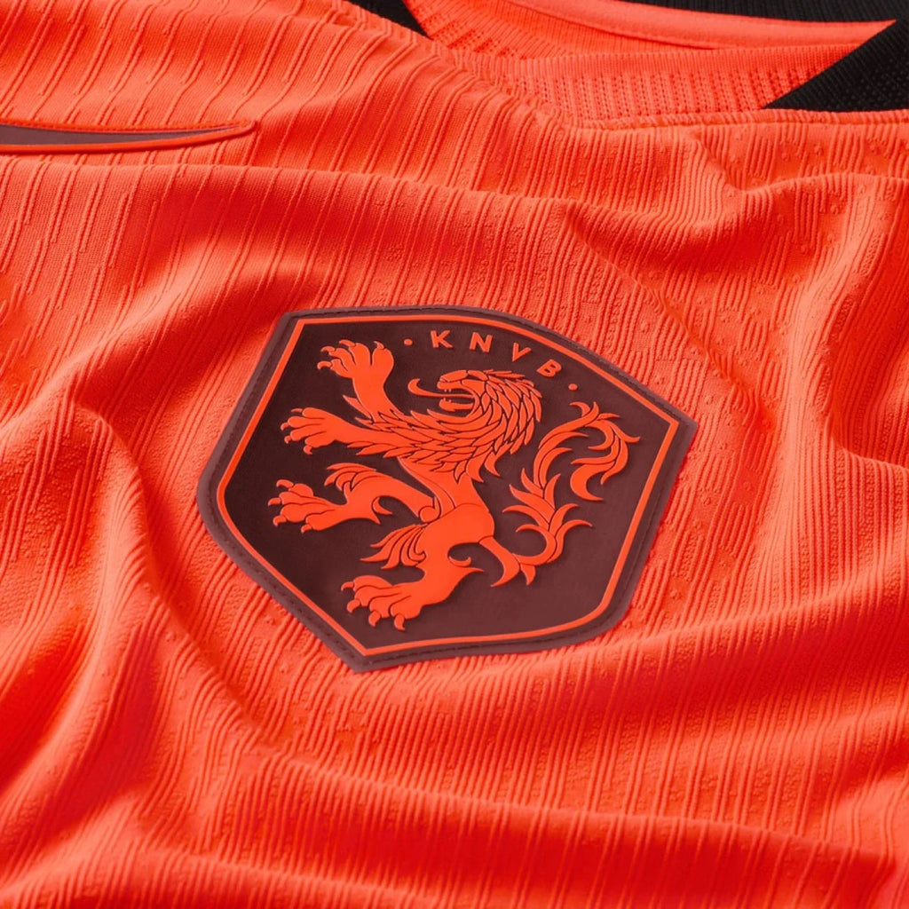 Close-up of the Netherlands Home FIFA World Cup Jersey 2026 featuring the KNVB crest in vibrant orange