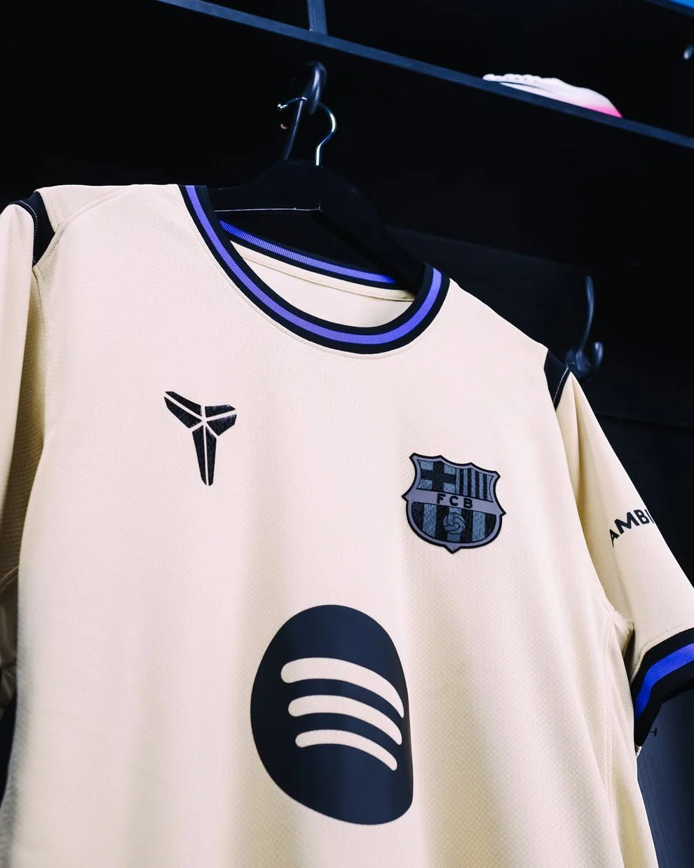 Hoop Store Barcelona away jersey 2025-26 cream with black crest Spotify logo and blue trim