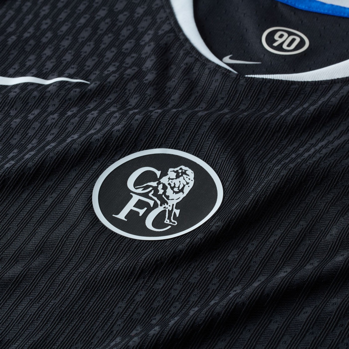 Hoop Store close up of Chelsea Third Jersey 2025-26 Player Version black textured fabric with white CFC lion crest