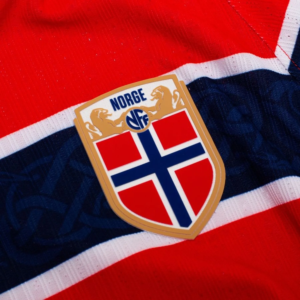 Close-up of Norway Home FIFA World Cup Jersey 2026 featuring the official Norge crest and vibrant colors