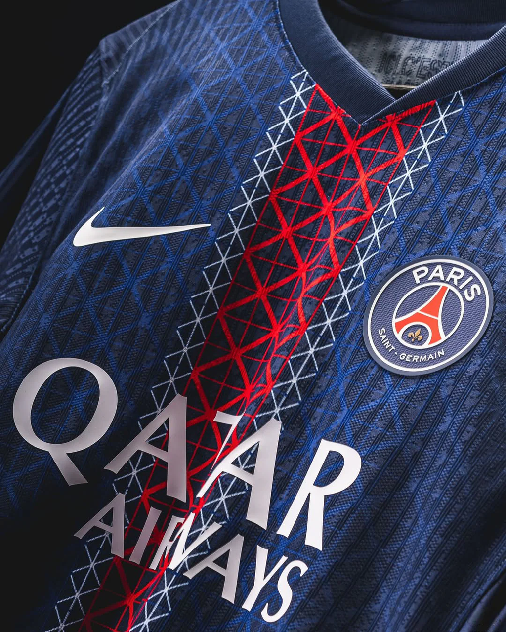 Paris home jersey 2025 Player Version in navy blue with red and white geometric patterns and Paris Saint-Germain logo