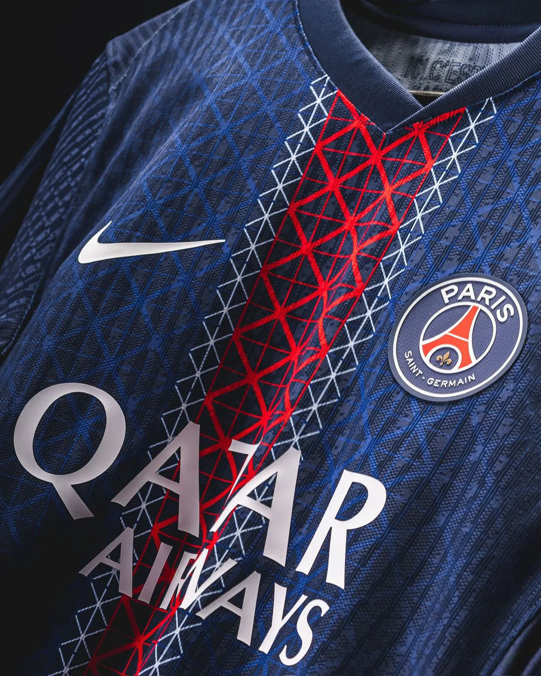 Paris home jersey 2025 Player Version in navy blue with red and white geometric patterns and Paris Saint-Germain logo