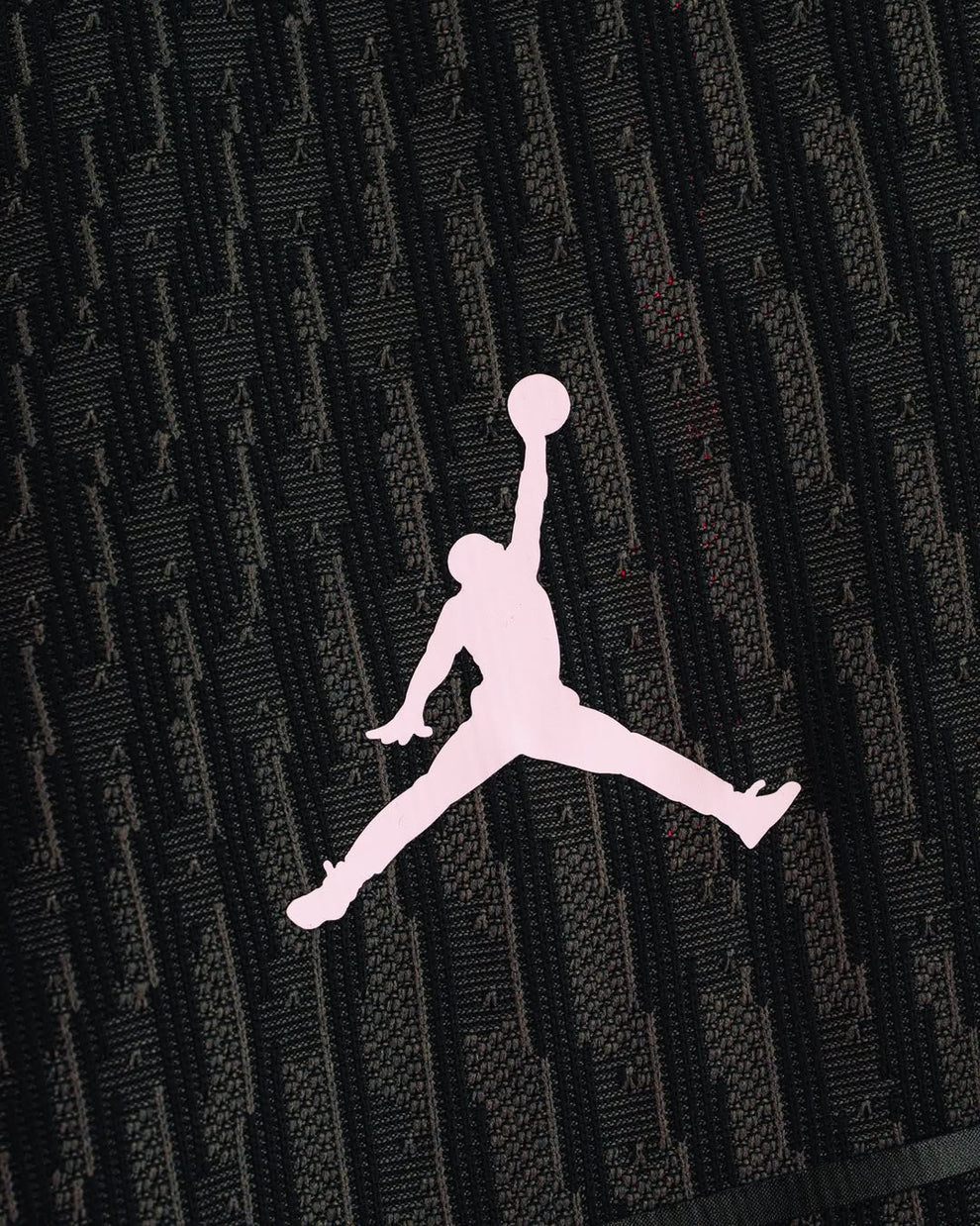 Close-up of pink Jumpman logo on the PSG fourth jersey 2025-26 player version showcasing detailed fabric design