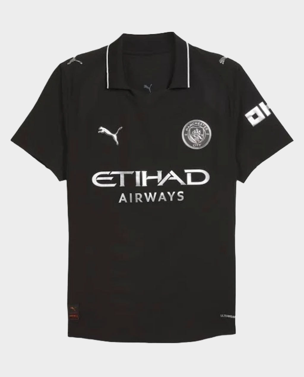 Hoop Store Manchester City away jersey 2025 in black with white logos and collar detailing