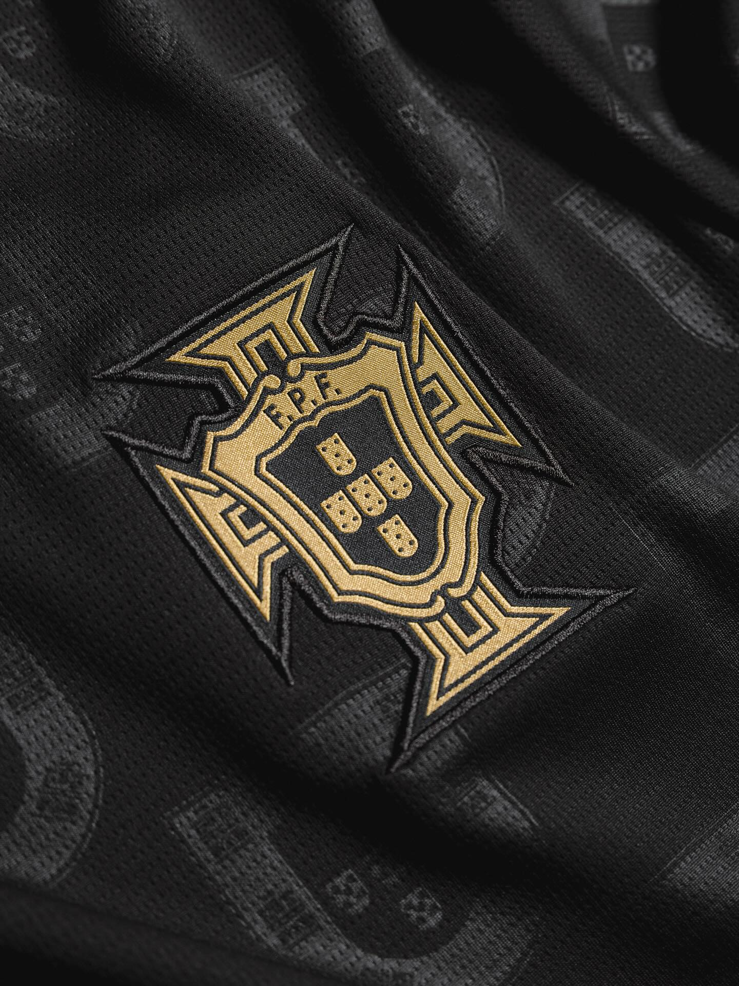 Portugal Panther Negra SE jersey featuring the gold emblem on a black fabric background