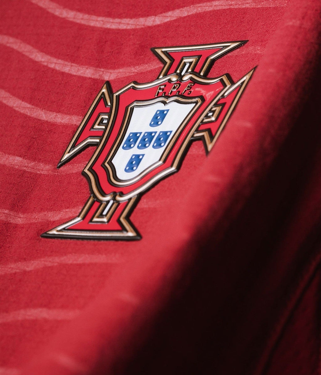 Close-up of the Ronaldo Portugal 2026 FIFA home jersey featuring the national crest in vivid detail