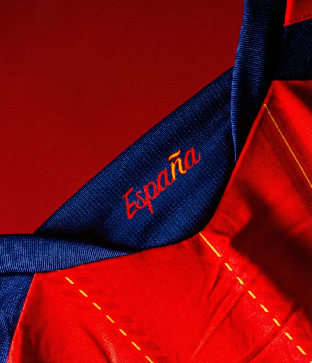 Close-up of Spain FIFA World Cup 2026 jersey showing embroidered EspaÃƒÂ±a on the collar