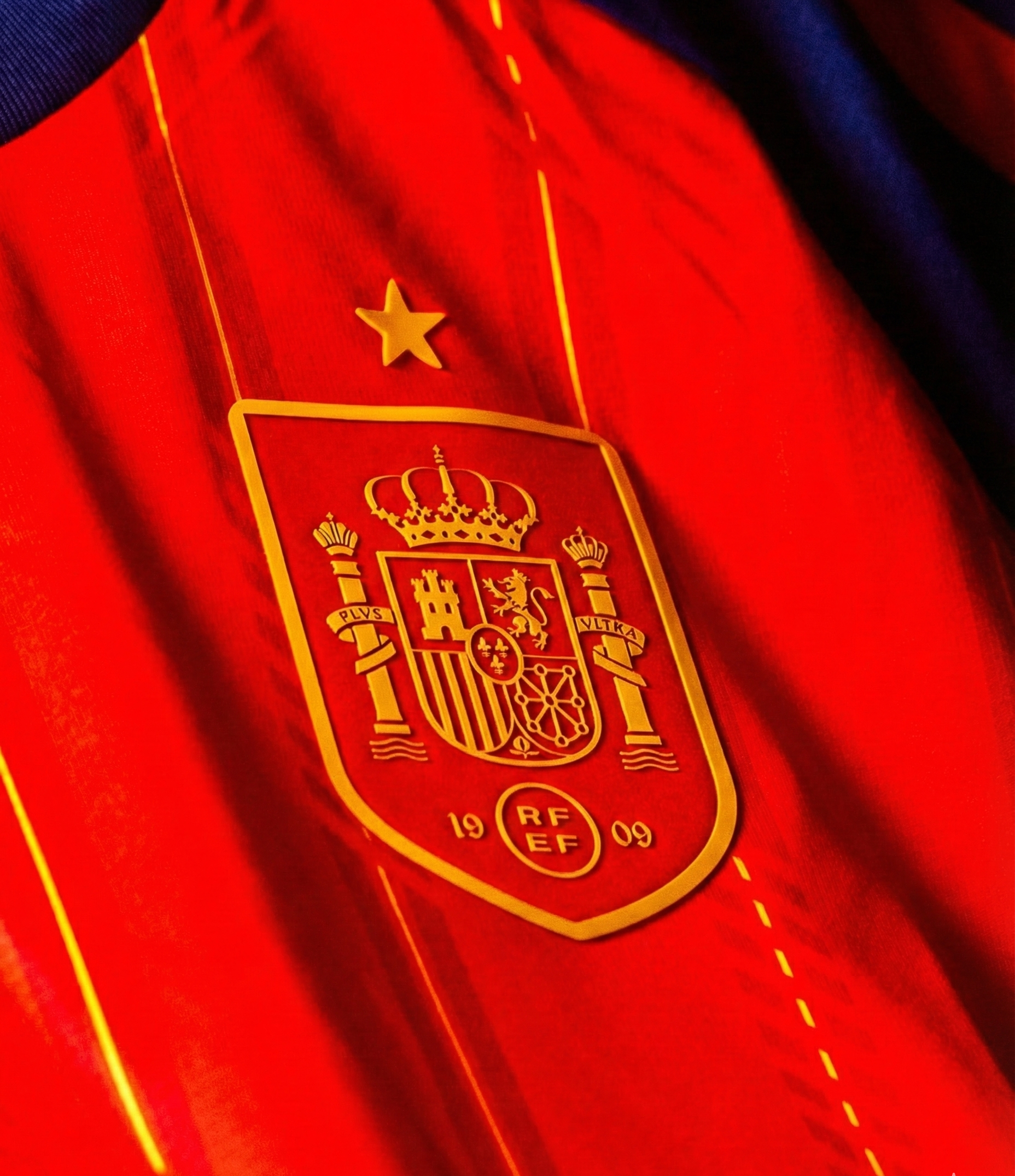 Close-up of Spain FIFA World Cup 2026 jersey featuring the emblem and vibrant colors